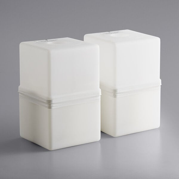 Two white rectangular Atrix HEPA filter containers with a band around them.