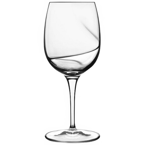 A close-up of a Luigi Bormioli Aero red wine glass with a wavy design.