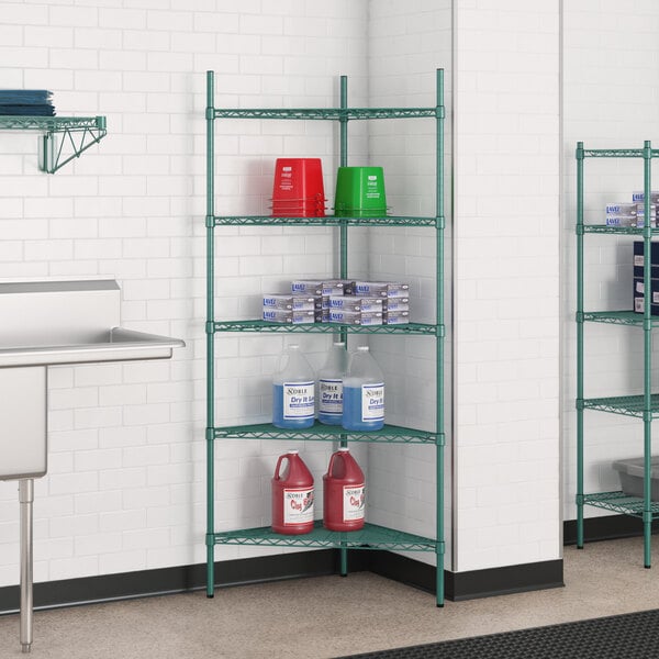 A green metal Regency wire shelving unit with shelves holding containers.