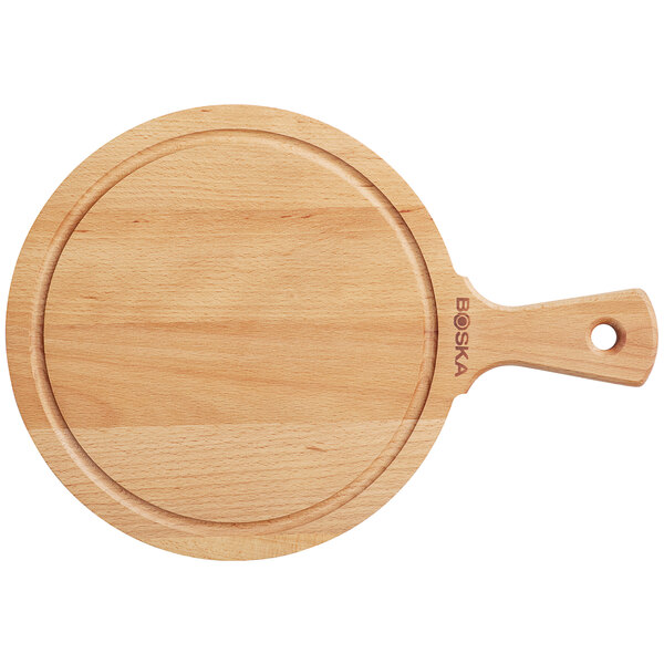 A Boska beech wood serving board with handle.
