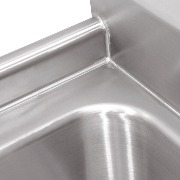 A stainless steel Advance Tabco two compartment pot sink with right drainboard.