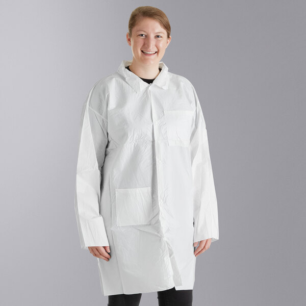 A woman wearing a Malt Impact white disposable lab coat.