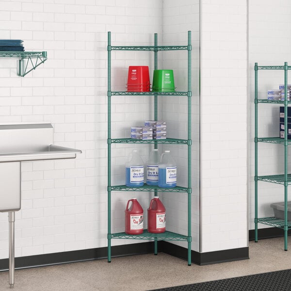 A green Regency wire shelving unit in a kitchen with bottles and containers.