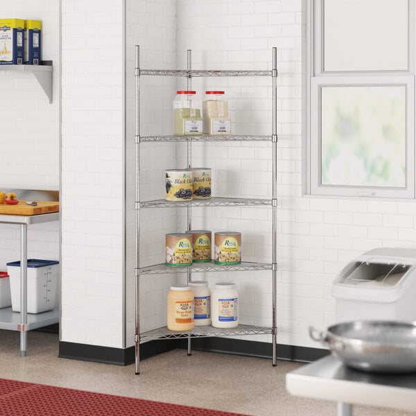 A metal Regency triangle wire shelf kit in a kitchen with cans on it.