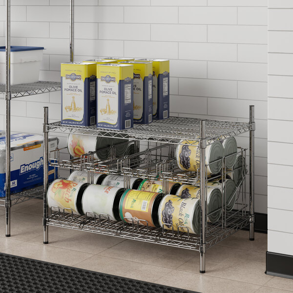 A Regency chrome wire shelf with can racks holding cans of food.