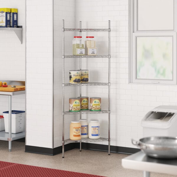 A metal Regency triangle wire shelf kit in a kitchen with cans on it.