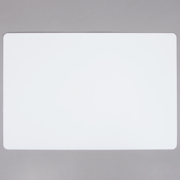 A white rectangular Tablecraft flexible cutting board with a black border.