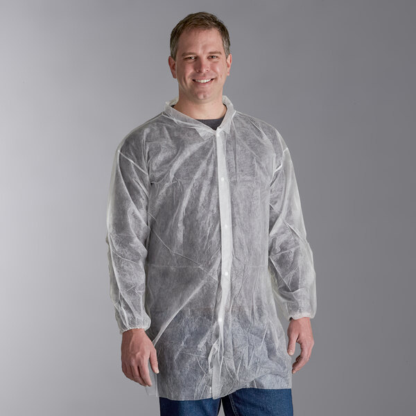 A man wearing a white Malt Impact lab coat with elastic wrists.