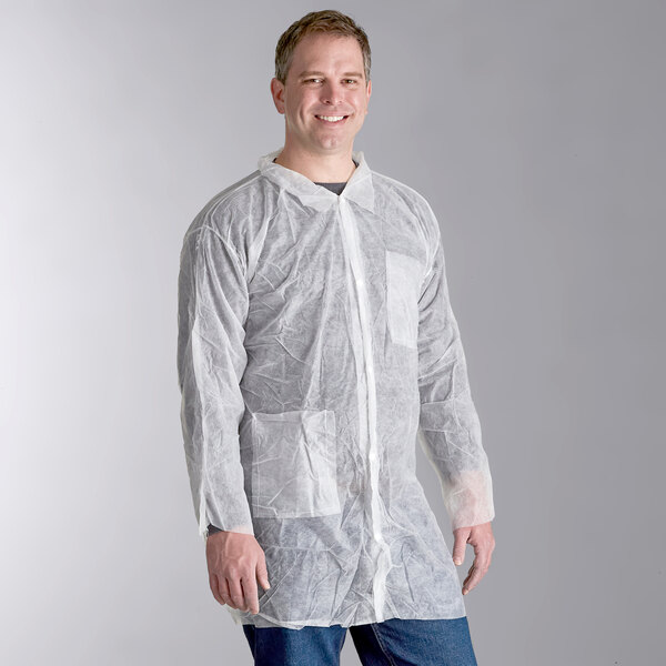A man wearing a white Malt Impact lab coat with open wrists.