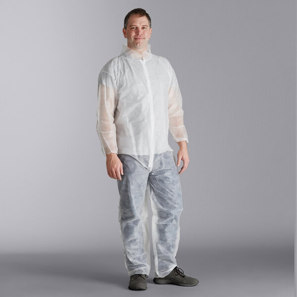 A man wearing white Malt Impact Polypropylene coveralls.