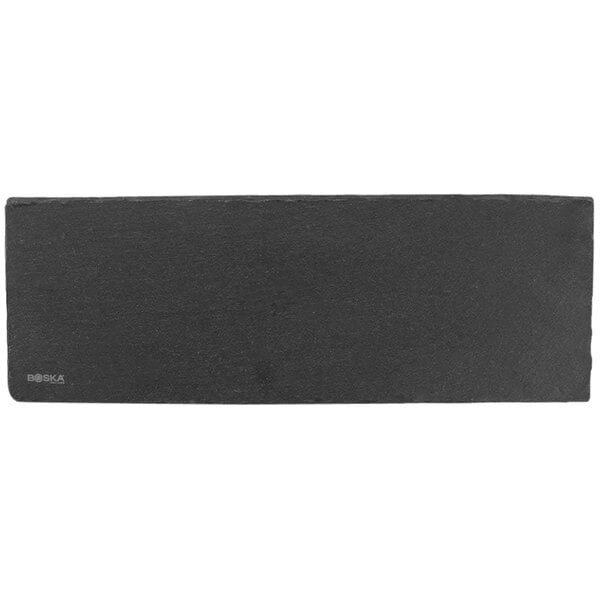 A rectangular black slate serving board.