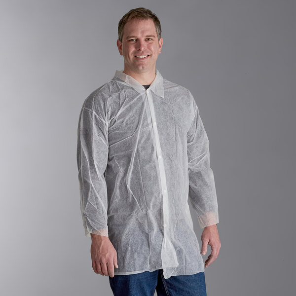 A man wearing a white Malt Impact lab coat smiling.