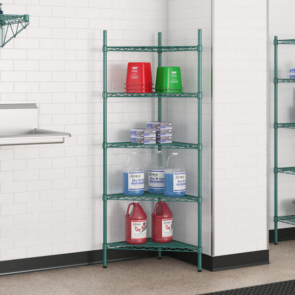 A green metal Regency 5-shelf wire shelving unit with containers and bottles.