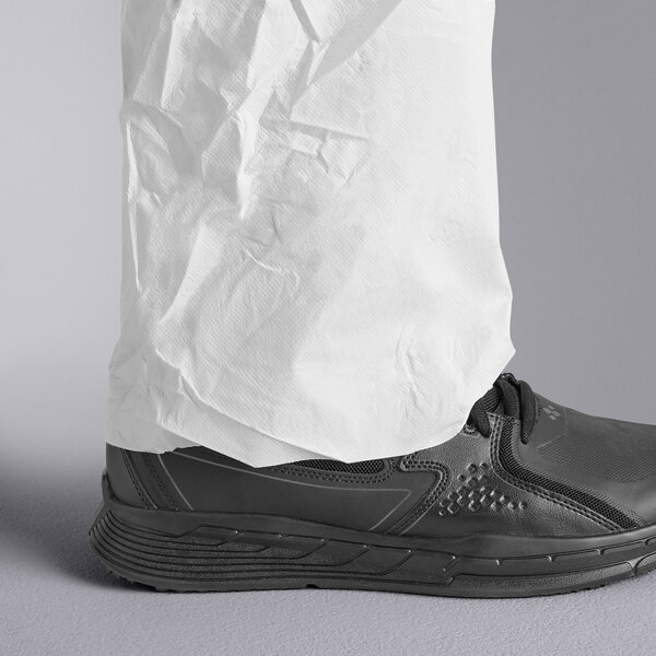 A person wearing white Malt ProMax coveralls.