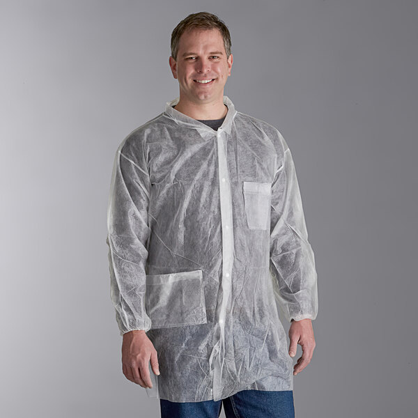 A man wearing a white Malt Impact lab coat with elastic wrists.