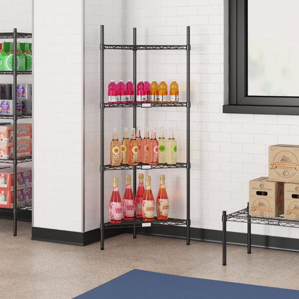 A black Regency wire shelf with bottles of liquid.