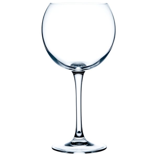 A close-up of a clear Chef & Sommelier balloon wine glass with a stem.