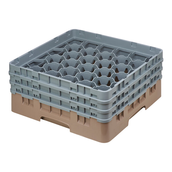 A beige plastic Cambro glass rack with many compartments and holes.