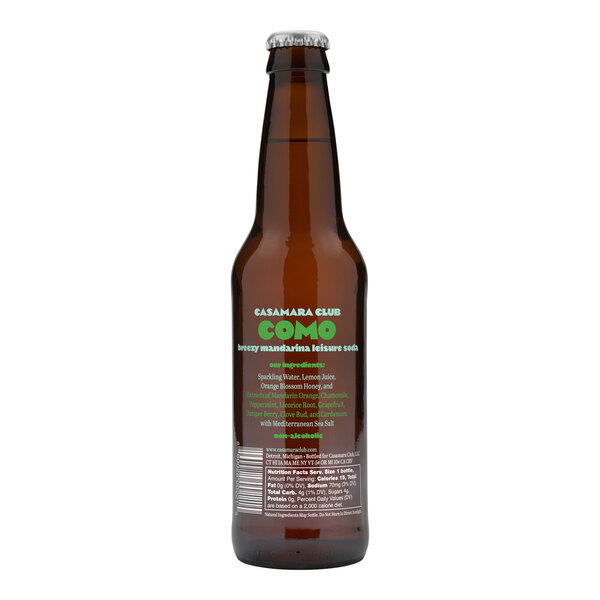 A close up of a brown Casamara Club Como Breezy Mandarina Leisure Soda bottle with green text.