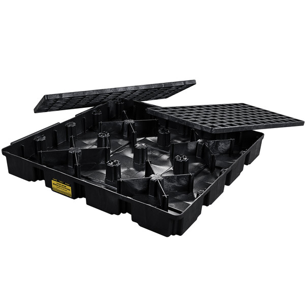 A black plastic Eagle Manufacturing spill containment platform with open lids for four drums.