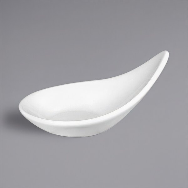 A white bowl with a curved edge on a gray background.