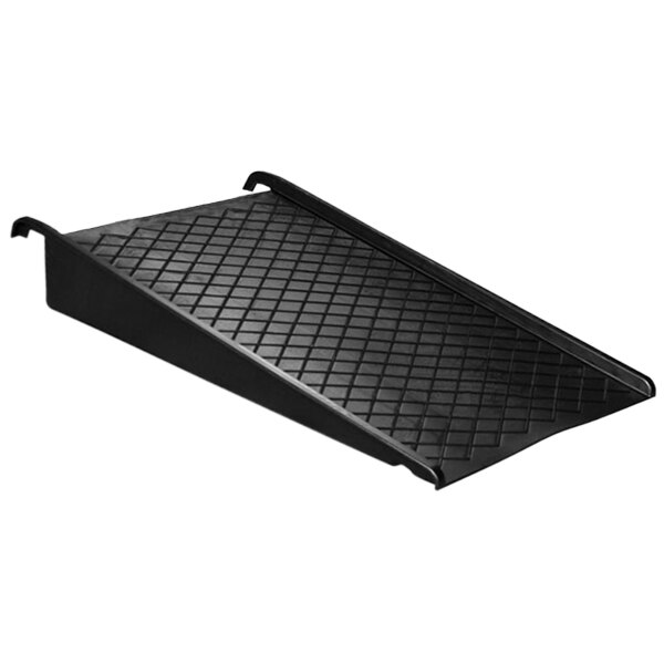 A black plastic ramp with a diamond pattern.