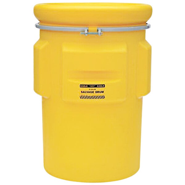 A yellow Eagle Manufacturing salvage drum with a metal bolt ring.