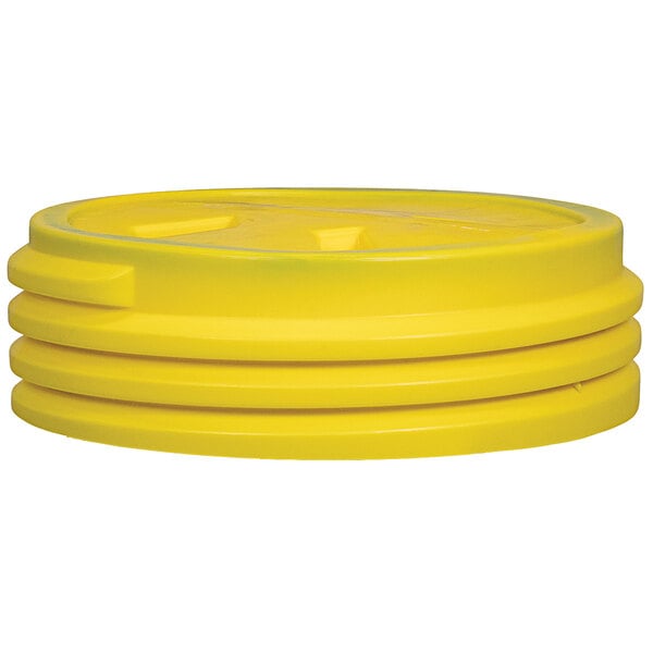 A close up of a yellow Eagle Manufacturing lab pack plastic barrel with a screw-on lid.