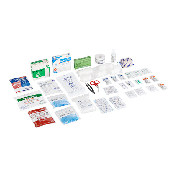 A Honeywell North first aid kit with various supplies on a white surface.