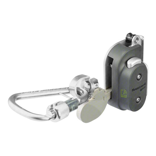 A close-up of a Honeywell Miller-Vi-Go silver metal carabiner with key attached.