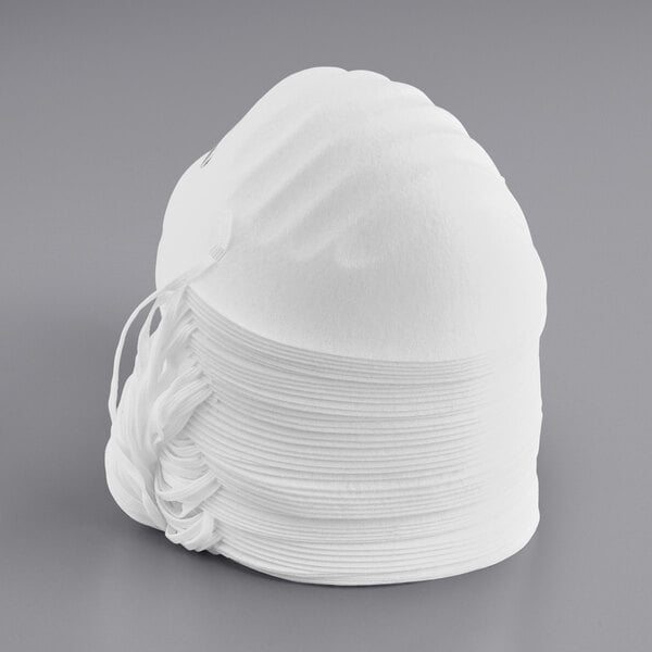 A stack of white Honeywell Disposable Dust Masks.