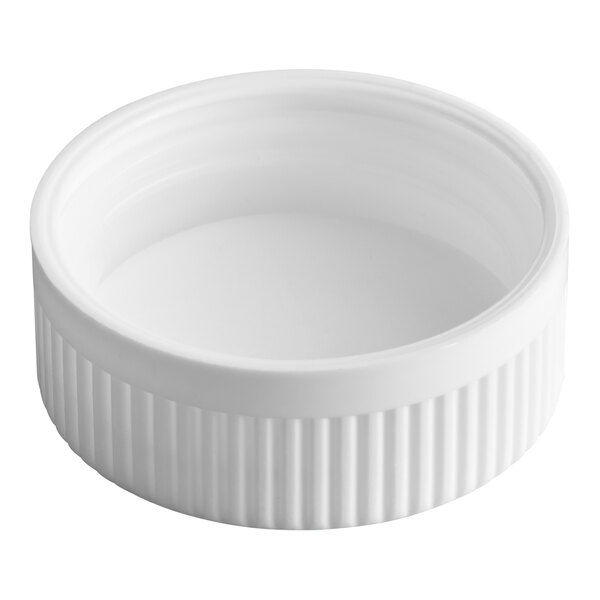 A white child-resistant cap with a ribbed edge and a pressure sensitive liner.