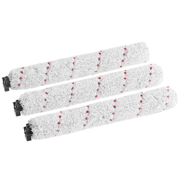 A close up of three white Sanitaire brush rolls.
