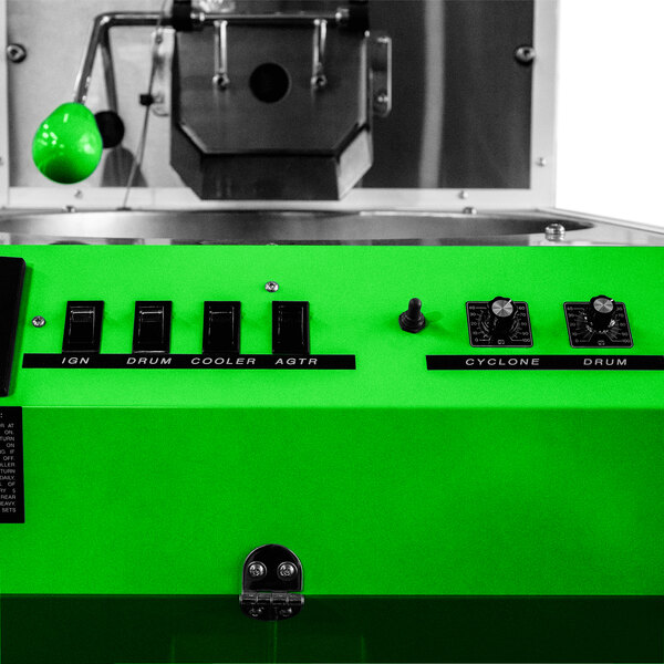 A green Primo RAVEN-X coffee roaster with black buttons.