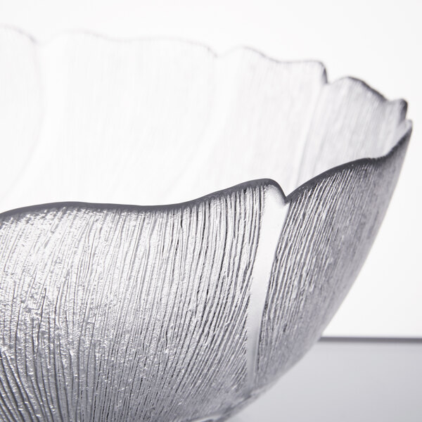 An Arcoroc glass bowl with a close up of the design.