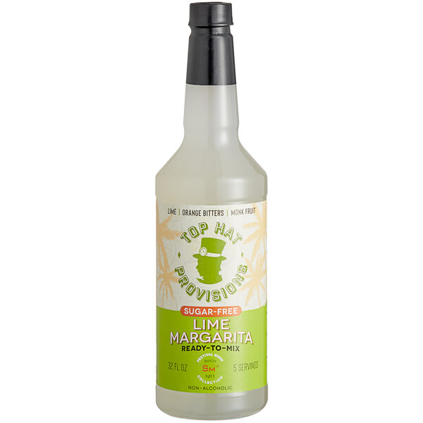 A bottle of Top Hat Provisions lime margarita mix with a lime on top.