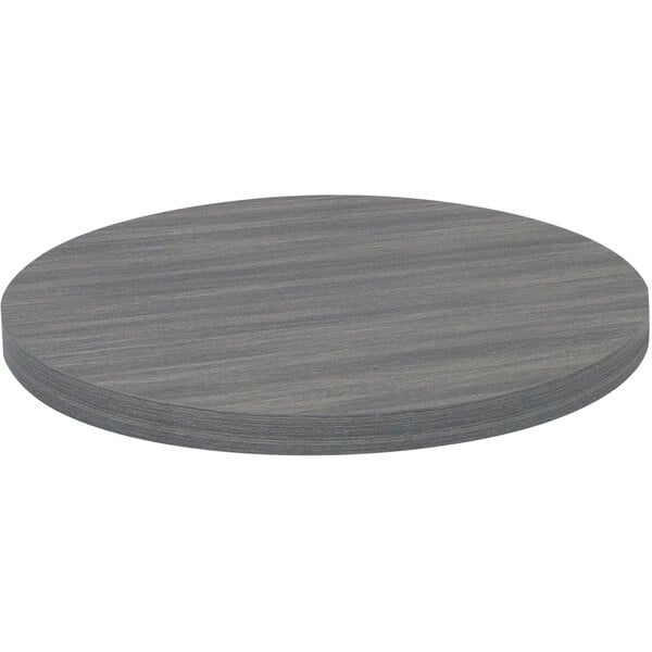 An American Tables & Seating light gray faux wood laminate round table top.