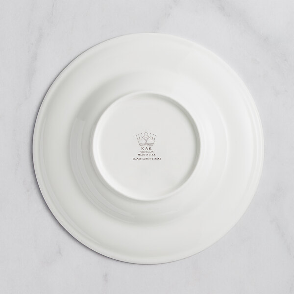 An ivory RAK Porcelain deep plate with an embossed floral pattern.