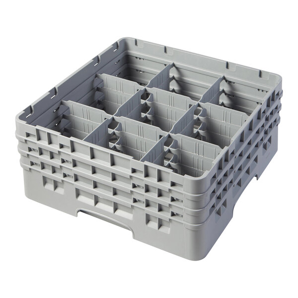 A grey plastic Cambro glass rack with 9 compartments.