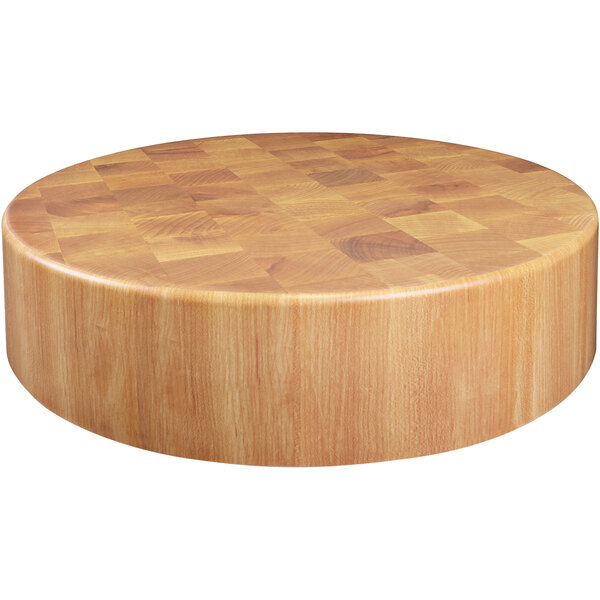 An Elite Global Solutions round faux wood melamine riser with a checkered pattern on a wooden table.