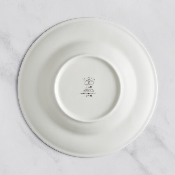 A RAK Porcelain ivory porcelain deep plate with an embossed design.
