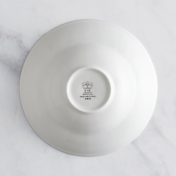 A RAK Porcelain ivory porcelain plate with an embossed floral design.