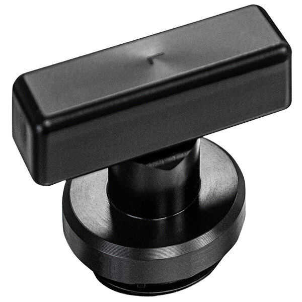 A black rectangular plastic button with a black knob.