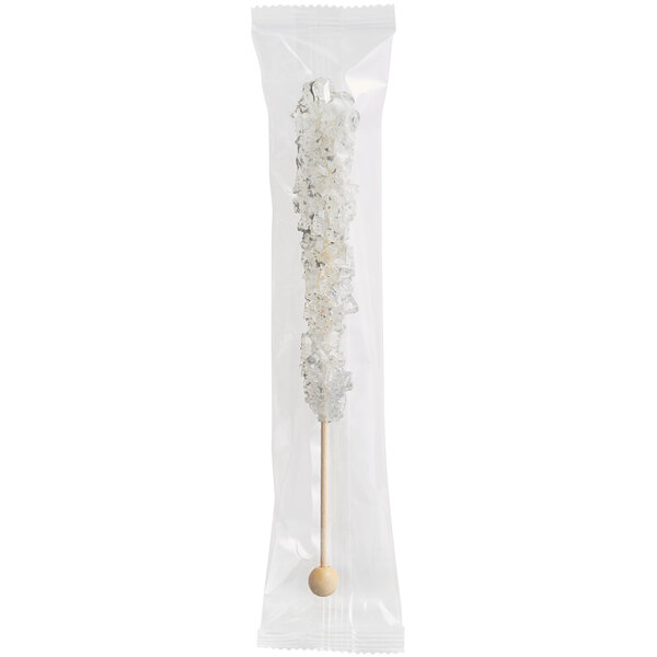 A plastic bag with a white and silver wrapped crystal stick inside.