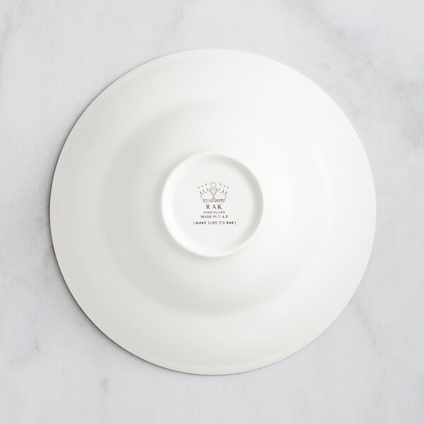 A RAK Porcelain ivory porcelain plate with an embossed blossom design.