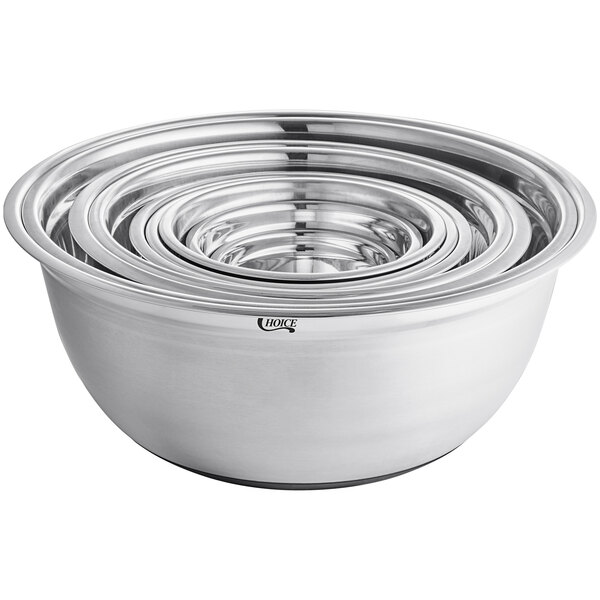 A stack of silver Choice stainless steel mixing bowls with silicone bottoms.