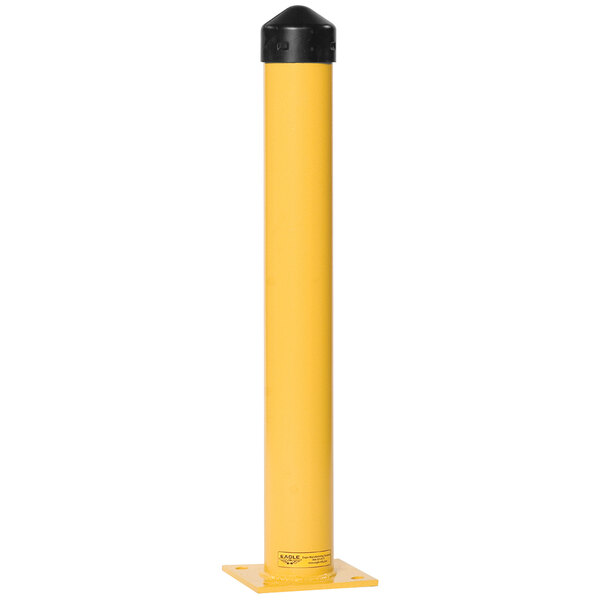 A yellow Eagle Manufacturing steel bollard post with a black cap on top.