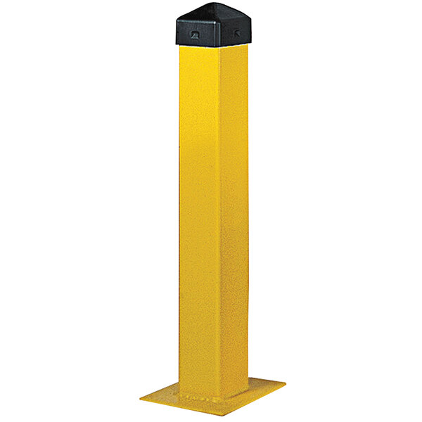 A yellow rectangular Eagle Manufacturing Safety Bollard post with a black cap.