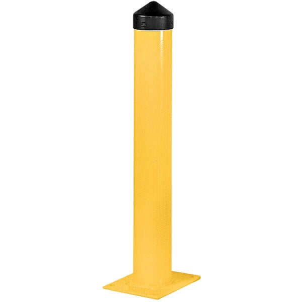 A yellow steel bollard post with a black cap on top.
