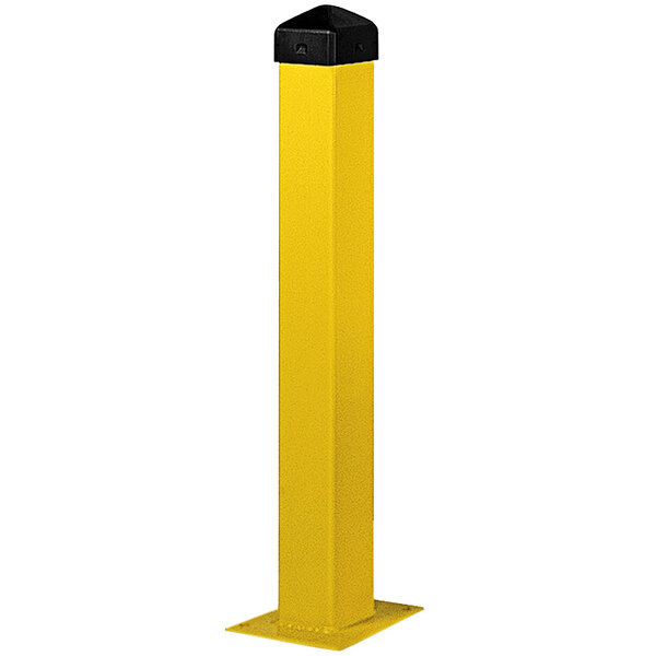 A yellow rectangular steel bollard post with a black cap.